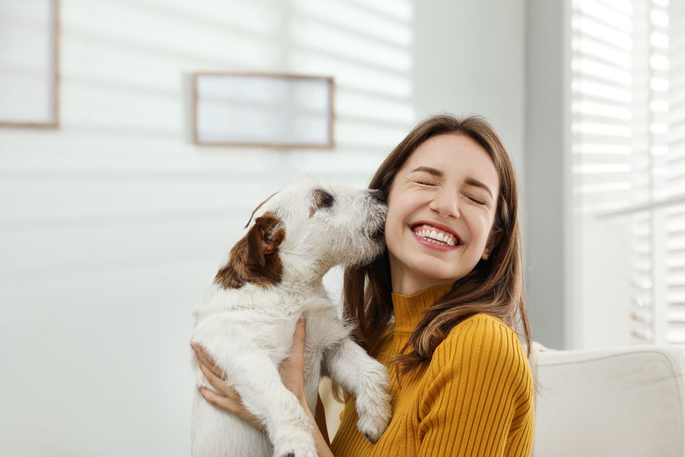 woman and dog happy together